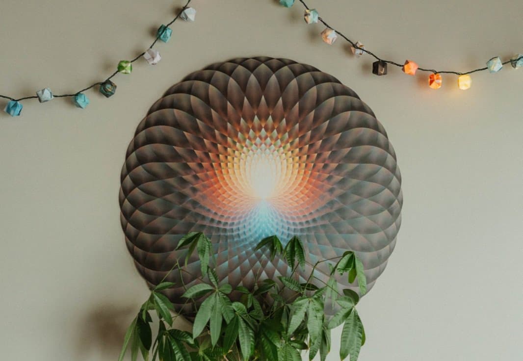 Colorful mandala art and a plant in the Samana lounge